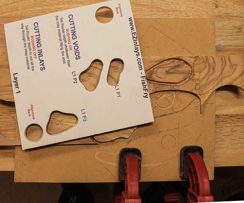 Inlay assembly clamped to workbench