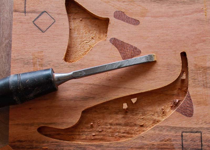 Using a chisel to clean up the void