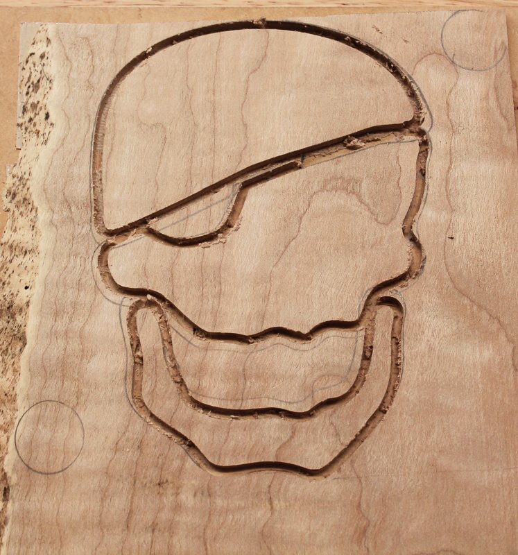 The 3 skull inlay pieces cut out